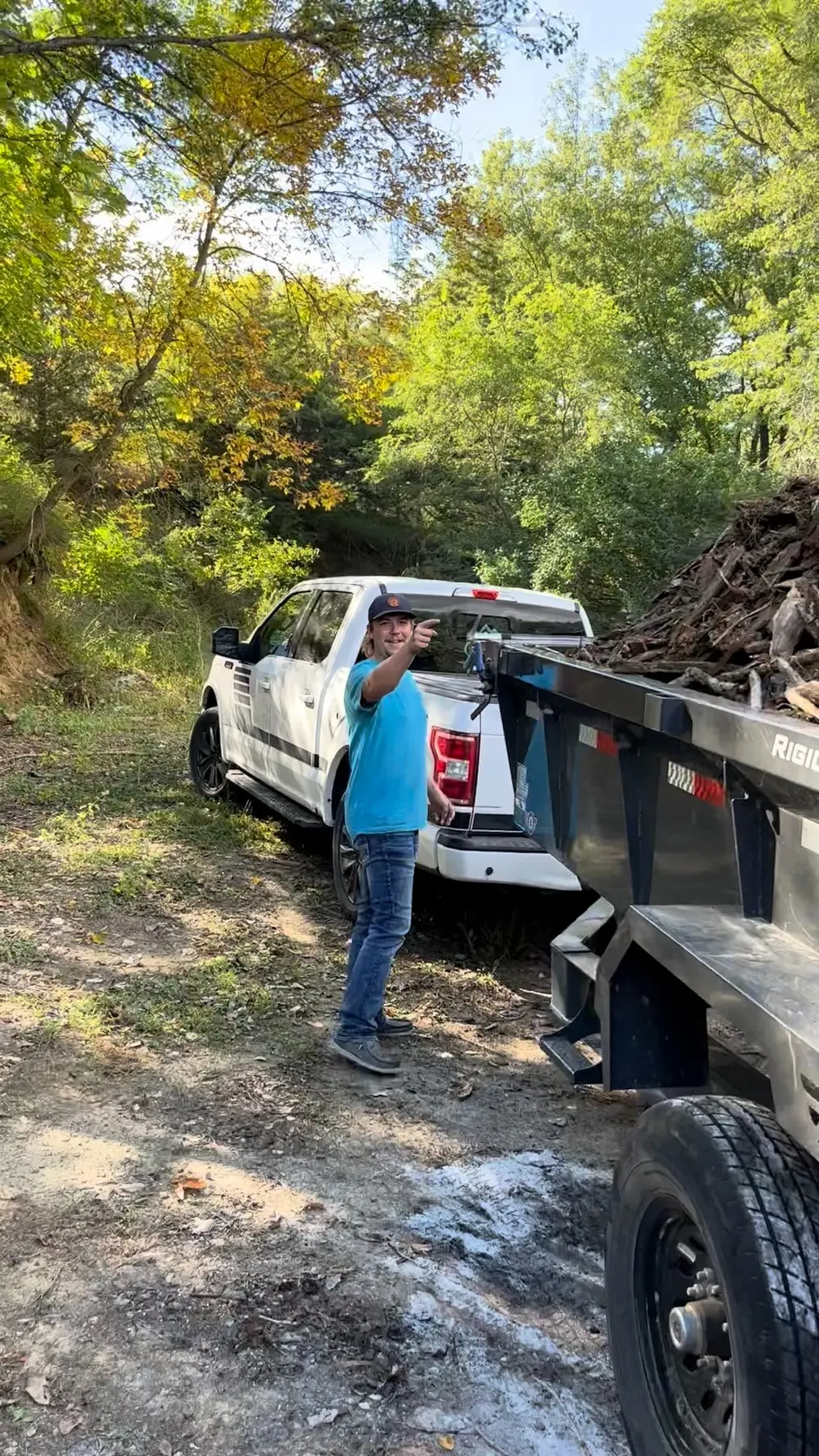 Braden unloading a trailer full of yard debris